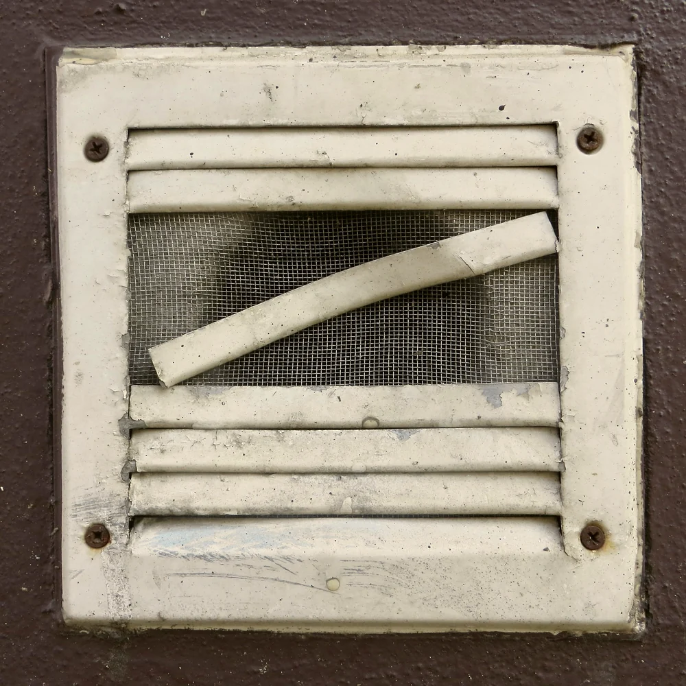 Grille d'aération encrassée, photo d'illustration